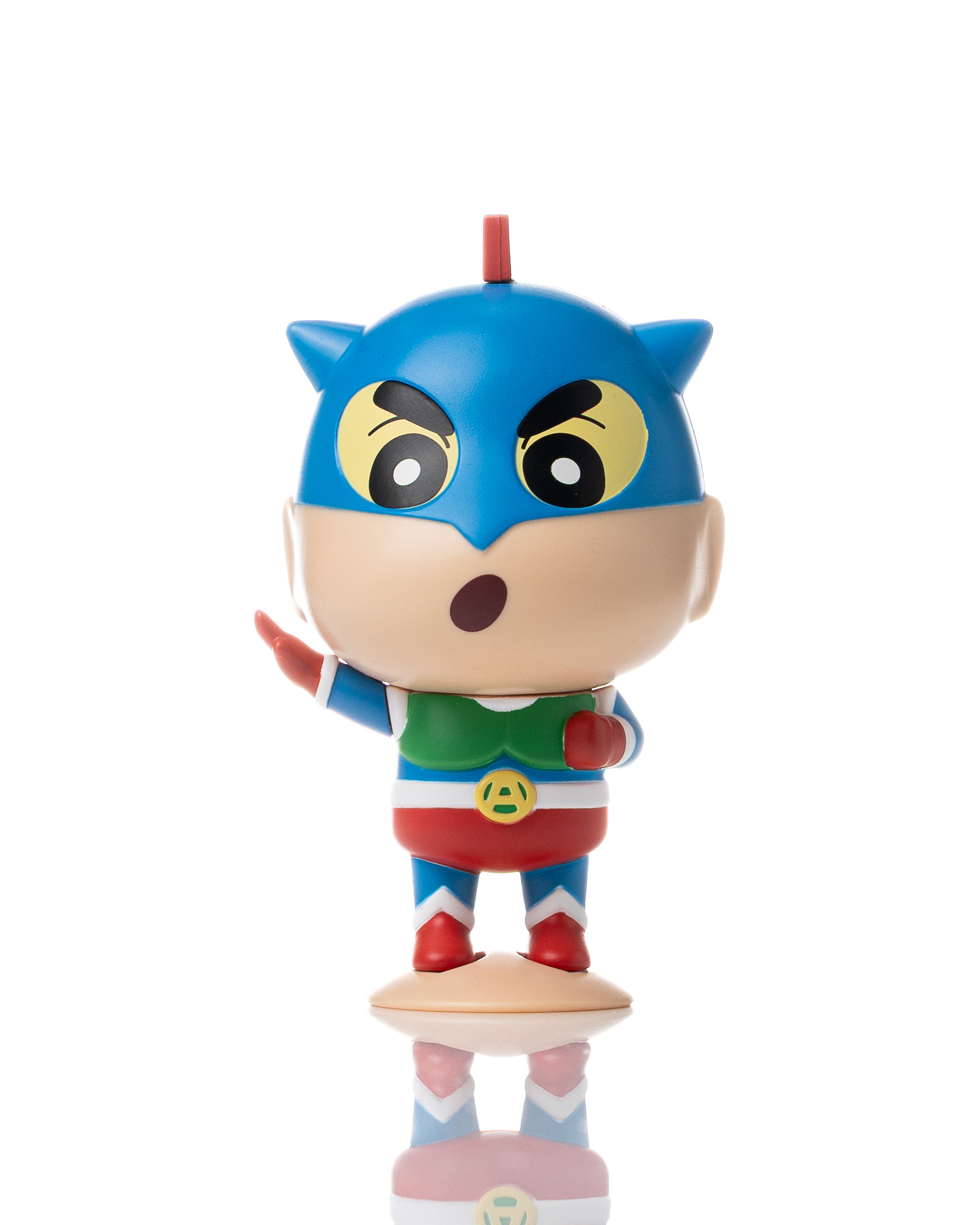 Blue character figure standing on a bright reflective studio surface